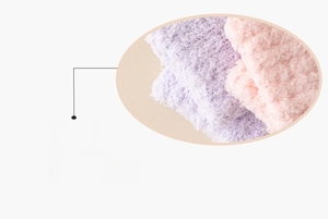 Close-up of soft coral fleece sock cuffs in pastel purple and pink with elastic texture