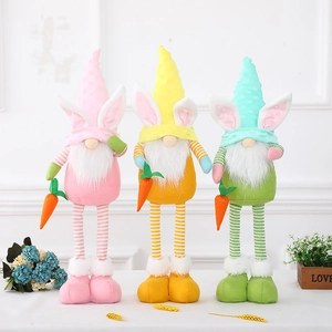 Three Easter gnome dolls with bunny ears and carrots in pink yellow and green colors