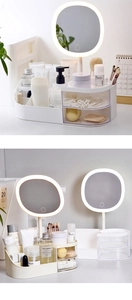 White makeup organizer with LED touch screen mirror and multiple storage compartments