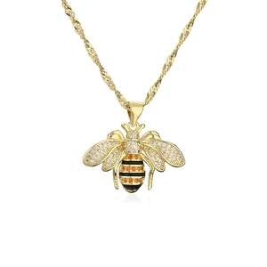 Golden bee pendant necklace with orange and white zircons on a delicate water wave chain