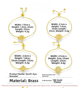 Detail of 18K gold plated brass bracelets with religious charms and adjustable slider