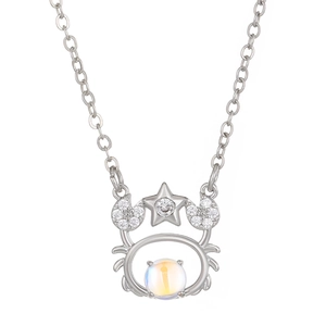 Silver zodiac cancer necklace with moonstone and pavé stones on white background