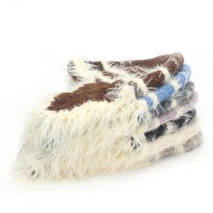 Detailed view of plush knit trapper hats in various colors with soft faux fur lining