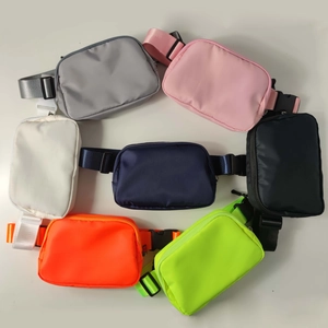 Flat lay of colorful waterproof nylon running waist bags in seven diverse color options