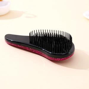 Starry sky detangling hairbrush with black handle and pink glitter finish