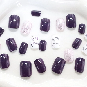Short square press-on nails set featuring purple tones and elegant floral patterns