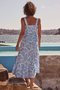 Detail of tiered skirt and smocked back on blue and white printed summer dress