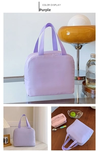 Detail of purple insulated lunch bag with reinforced handles and durable zipper closure