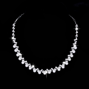 Silver bridal necklace set with lustrous pearls and sparkling rhinestones for weddings
