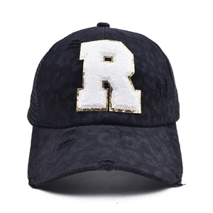 Close-up of leopard print baseball cap with chenille R patch and mesh back detail