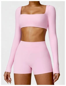 Close-up of pink long-sleeve square neck yoga top and high-waisted fitness shorts