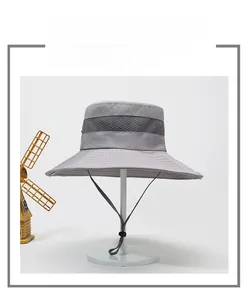 Detail of grey outdoor sun hat with breathable mesh vents and adjustable windproof cord