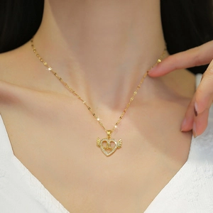 Golden heart wing pendant necklace for women with mama text and swan detail