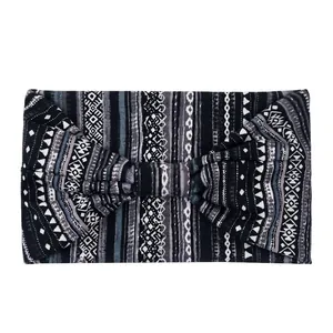 Detail view of ethnic geometric pattern wide headband with center bow decoration