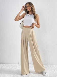 Women high waist pleated wide leg trousers in khaki paired with a white halter top