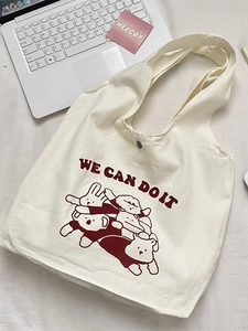 Sac fourre-tout en toile à motif animaux mignons et slogan sur un bureau blanc