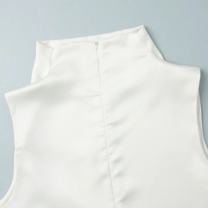 Detail of white satin sleeveless top showing high collar and back invisible zipper