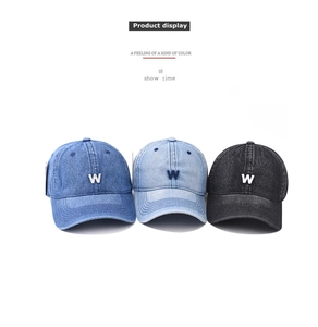 Three washed denim baseball caps with embroidered W logo in navy, light blue, and black