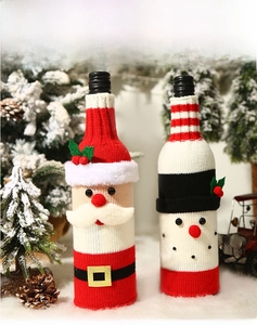 Detailed knitted Christmas wine bottle covers featuring Santa and Snowman designs