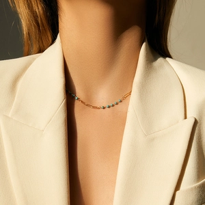 18K gold-plated necklace featuring unique paperclip chain and turquoise beads on a model