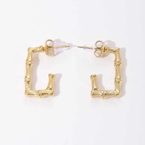 Detail of 14K gold plated bamboo texture J-shaped titanium steel earring with stud back