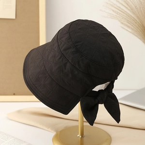 Close-up of winter quilted bucket hat featuring a stylish back opening and bow detail
