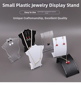 Close-up of plastic jewelry display stands for necklaces and earrings in black and white