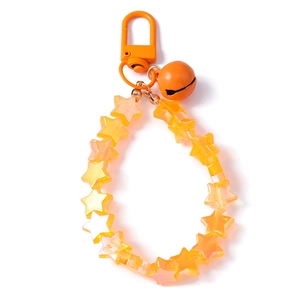 Handmade beaded keychain with yellow stars, orange bell and metal hook on white background