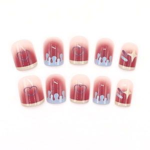Sweet blush French press-on nails with red gradient, blue heart and star designs