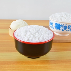 Close-up of realistic artificial rice bowl photography prop with glossy white grains