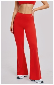 Detail of red high-waisted flared yoga pants with supportive wide waistband