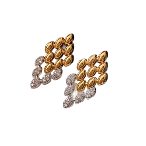 Boucles d'oreilles minimalistes en forme de feuille avec strass et accents or et argent