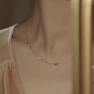 Elegant 18K gold plated silver clover necklace with small sparkling diamond accents