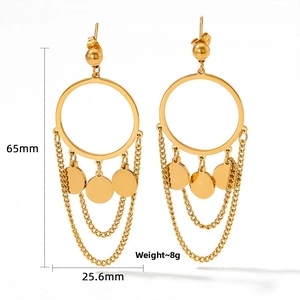 Detail view of gold fringe earrings featuring layered discs and long chain tassels
