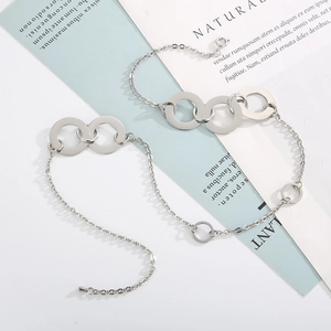 Detail of silver titanium steel interlocking triple ring chain necklace with lobster clasp