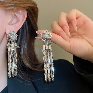 Silver rose leaf tassel earrings with metallic finish for women showing elegant drape