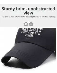 Detail of reinforced brim on black baseball cap with white SILENT embroidery