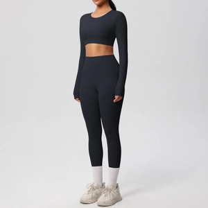Detail of high-waist black yoga leggings with functional side pockets and elastic fabric