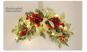 Macro shot of artificial red berries, pine cones and warm LED lights on festive wreath