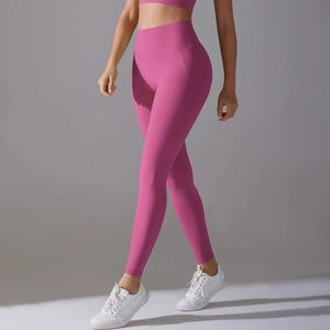 Detail of high-waisted hot pink yoga leggings with seamless design and body-hugging fit