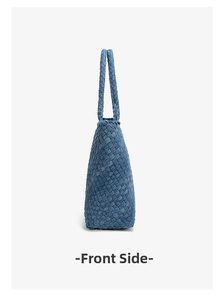 Side view of woven denim blue tote bag showing the textured fabric pattern and thickness