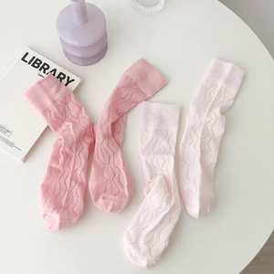 Sweet pink knit socks with hollow wavy patterns and elastic ribbed cuffs for women