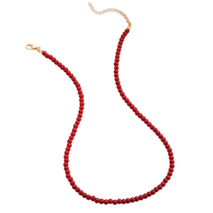 Detail of red beaded necklace with gold lobster clasp and adjustable extension chain