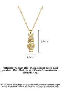 Detail of titanium steel rabbit girl pendant with gold finish and cubic zirconia inlay