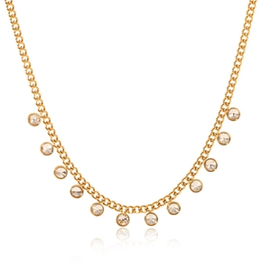 Detailed view of a gold tassel necklace featuring multiple clear round zircon pendants