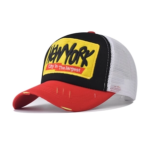 Detail of New York 3D embroidery and distressed brim on breathable trucker mesh cap