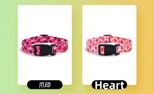 Detail of dog collars featuring black paw prints and red hearts with black plastic buckles
