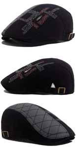Detail view of vintage flat cap featuring fashion embroidery and grey quilted side panels