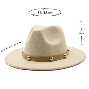 Detail of beige fedora hat with brown band featuring gold metallic studs and size markings