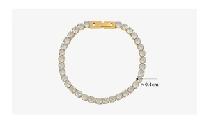 Detail of 18k gold plated tennis bracelet featuring 4mm round clear zircon stones